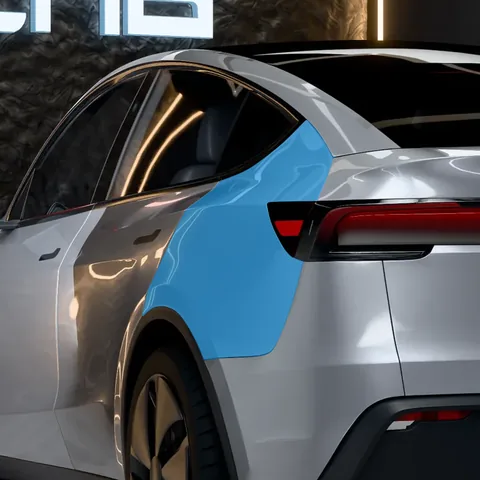 PPF ailes arrière Tesla Model Y : la zone protégée en bleu, sur une Model Y Juniper Premium vue de trois quarts arrière
